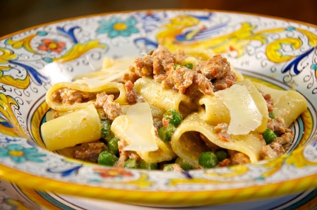Calamarata pasta with sausage, peas and ricotta cheese